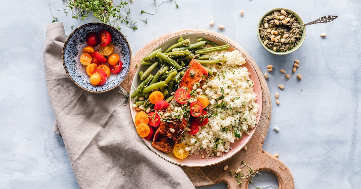 Perfectly cooked sous vide steak next to traditional pan-seared steak